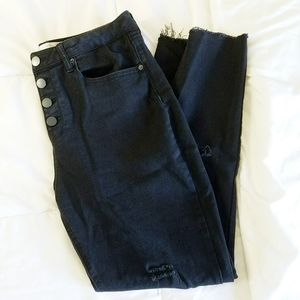 Distressed black skinnies